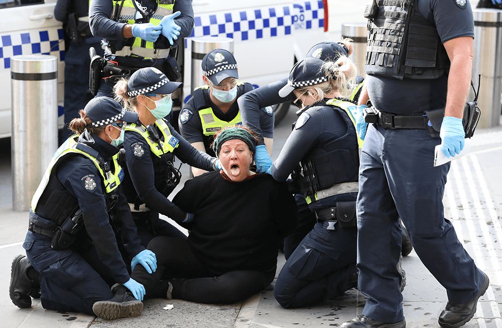 Police arrest a woman at Flinders st station after she allegedly tried to bite an officer. Canon 1D X Mark II, EF70-200mm f/2.8L IS III USM lens @ 95mm. 1/1250s @ f4, ISO 2000.