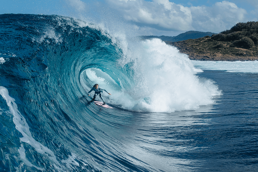 Image of Laura Enever in this huge barrel taken by Matt Dunbar using Canon 1D X Mark II, EF50mm f/1.4 USM lens. 1/1600s @ f5.6, ISO 250