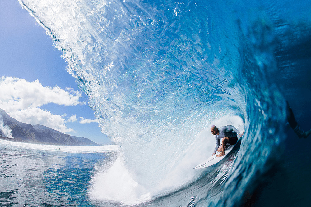 Kelly Slater in a big blue barrel at Teahupoo, Tahiti. Taken by Matt Dunbar using a Canon 1D X Mark II, EF15mm f/2.8 Fisheye lens