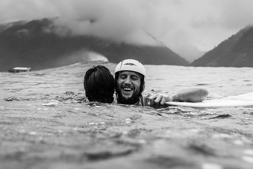 Owen Wright embraces close mate and rival Gabriel Medina after winning the 2019 Tahiti Pro taken by Matt Dunbar using a Canon 1D X Mark II, EF24-70mm f/2.8L II USM lens @ 50mm