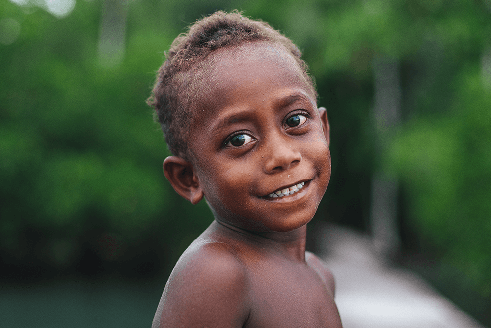 A local child from a village in the Solomon Islands. Taken on a SurfAid trip by Matt Dunbar using a Canon 5D Mark IV, EF50mm f/1.4 USM lens