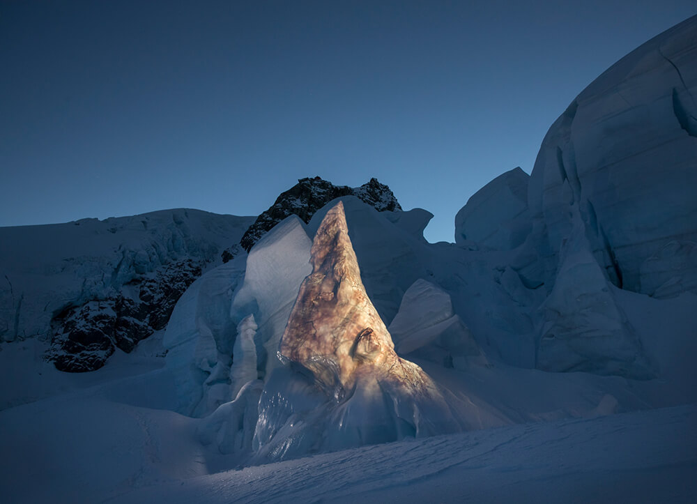 Sand stone projected on glacier