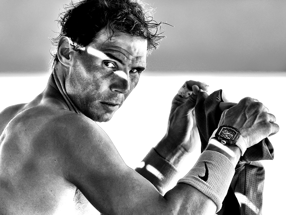 Rafael Nadal of Spain changes his shirt during a break in his quarterfinal match against Denis Shapovalov of Canada on January 25th CREDIT: AP Photo / Hamish Blair