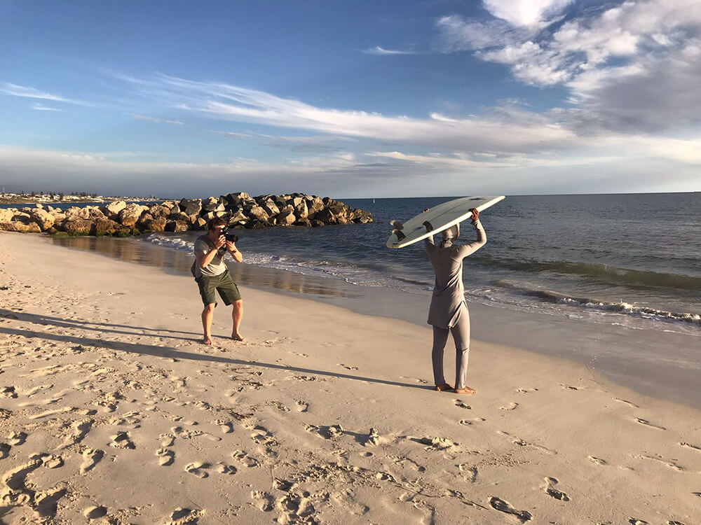 behind the scenes photo of a Muslim surfer