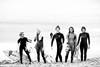 Black and white photo of female surfers