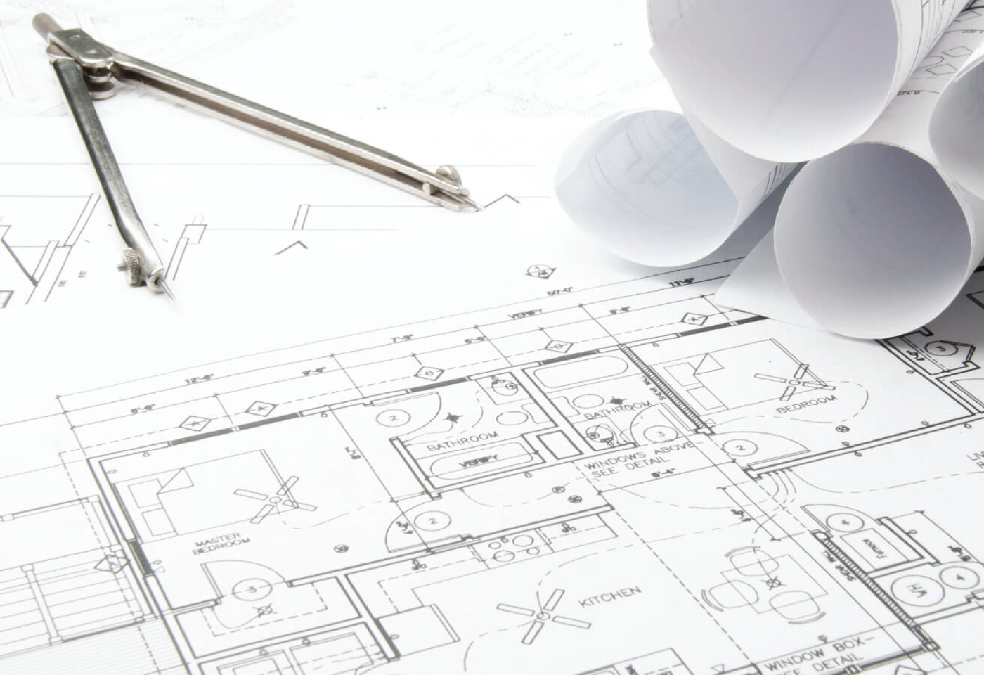 Floorplans at a drafting table