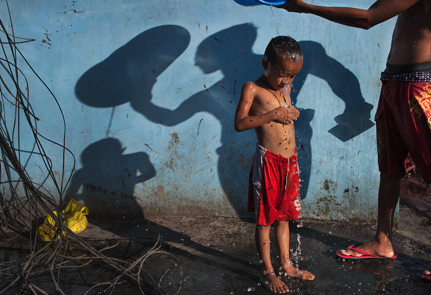 Father bathing child 