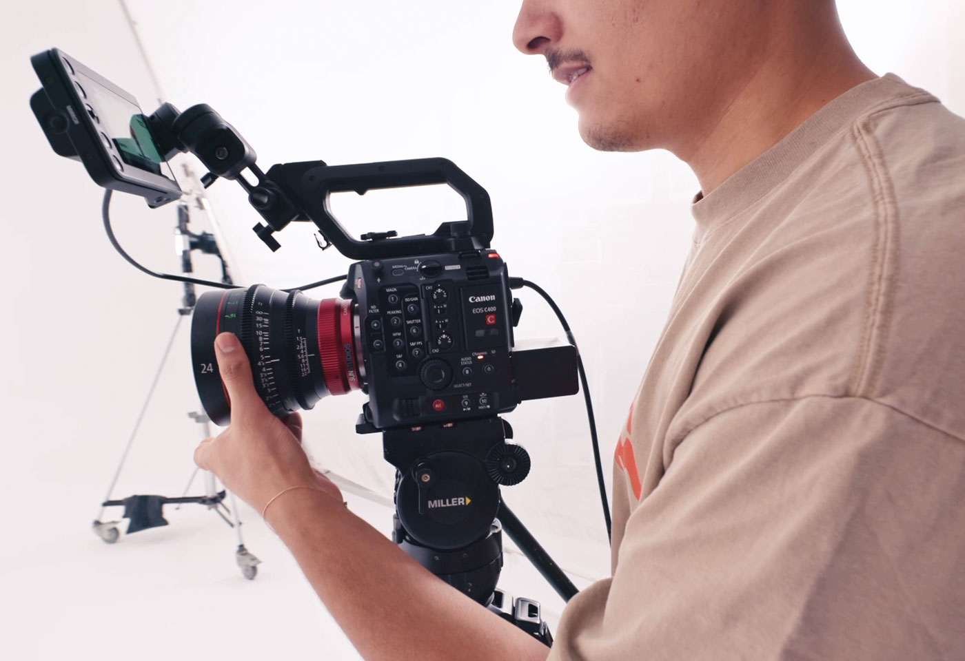 Man in a studio holding the Canon EOS C400 Tile Image